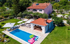 Awesome home in Gruda with Outdoor swimming pool, Jacuzzi and 4 Bedrooms